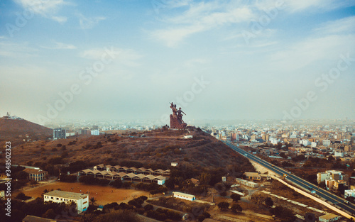 a huge monument on Africa's independence mountain with a view of the city photographed from the throne photo
