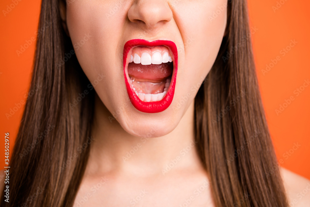 Closeup cropped photo of attractive lady grinning yelling loud bright red pomade amazing celebrity smile half face dentistry concept isolated vibrant orange color background Closeup cropped photo of attractive lady grinning yelling loud bright red pomade amazing celebrity smile half face dentistry concept isolated vibrant orange color background