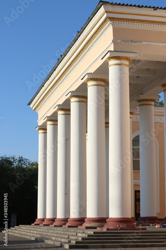 White columns with gold pattern of the theatre.  Old restored Building of the times of the USSR