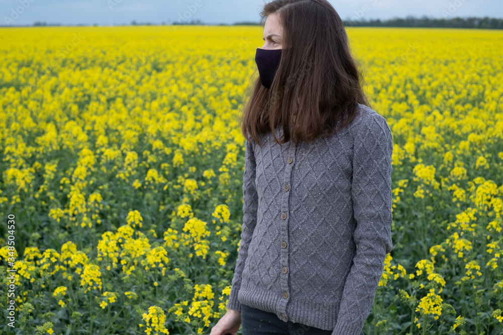 portrait of a girl in a black mask on a background of yellow flowers.outdoors
portrait of a girl in a black mask on a background of yellow flowers.outdoors