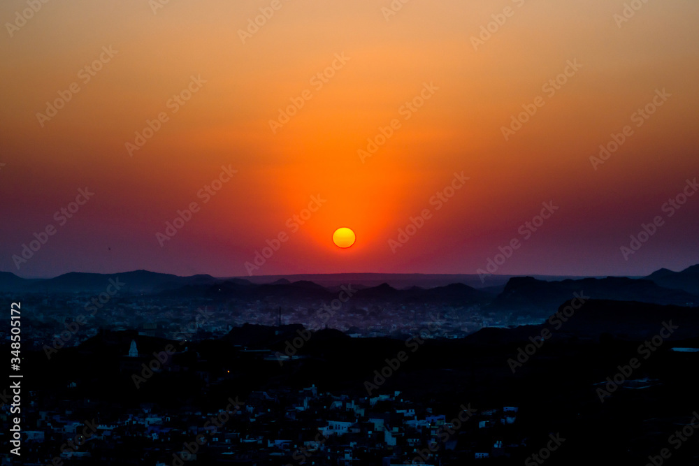 Fototapeta premium Sunset at Jodhpur city aerial view from top of Mehrangarh or Mehran Fort 