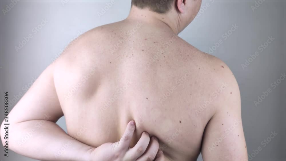 Shoulder pain. A man at a doctor’s appointment with a vertebrologist complaining of pain in the interscapular region and back. Shoulder pain. A man at a doctor’s appointment with a vertebrologist complaining of pain in the interscapular region and back.