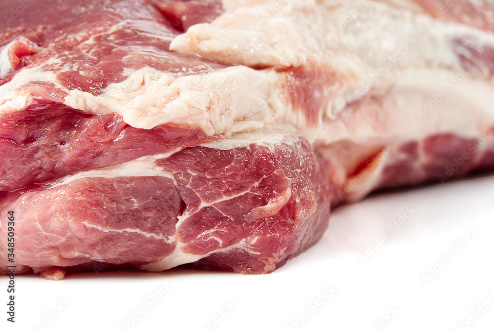 Fresh raw pork neck meat isolated on white background. Pork belly on a white background. Raw pork neck boneless, close-up, isolated.