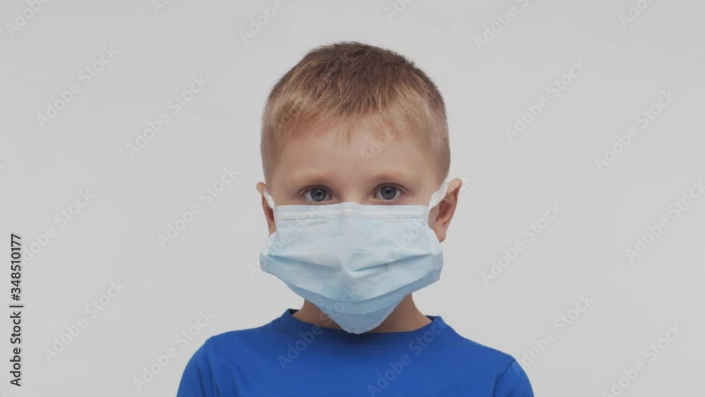 Portrait of little boy in medical mask. Healthcare, pandemic and protection. Portrait of little boy in medical mask. Healthcare, pandemic and protection.