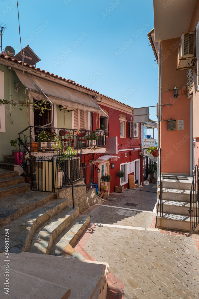 Obraz premium the city of Parga, a typical street, with houses painted