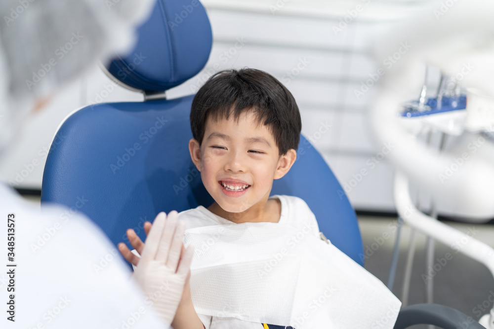 A boy having teeth examined at dentists: Healthy lifestyle, healthcare, and medicine concept. A boy having teeth examined at dentists: Healthy lifestyle, healthcare, and medicine concept.