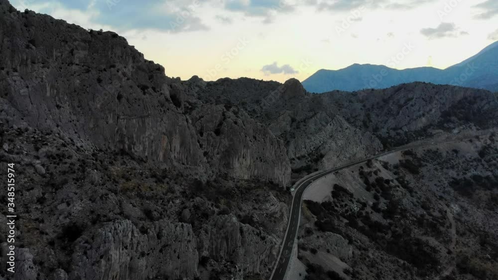 Aerial View Of High Rocky Mountain Landscape With Highway In The Morning Aerial View Of High Rocky Mountain Landscape With Highway In The Morning