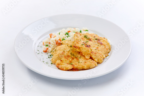 fried chicken breast with rice and vegetables on the white background