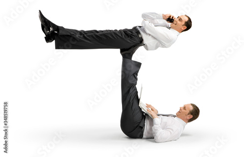 Fotografia Business acrobats balancing in various poses on a white background