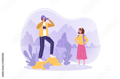 Travelling, couple, hiking, tourism, nature concept. Young couple in love man watching binoculars woman hikers travelers backpackers in mountain valley. Vacation trip active lifestyle and recreation.