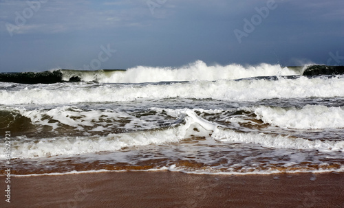 Storm on the beach. Ocean waves during a storm on a sandy beach. 