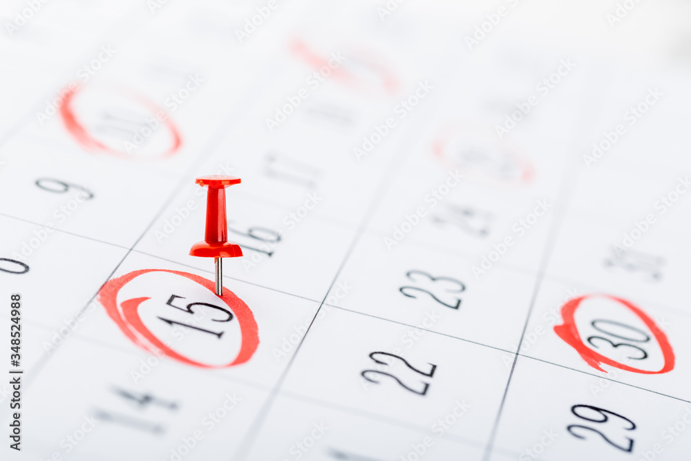 2020 calendar page marked with an important date in red pin. timeline, time, concept, idea, management 2020 calendar page marked with an important date in red pin. timeline, time, concept, idea, management