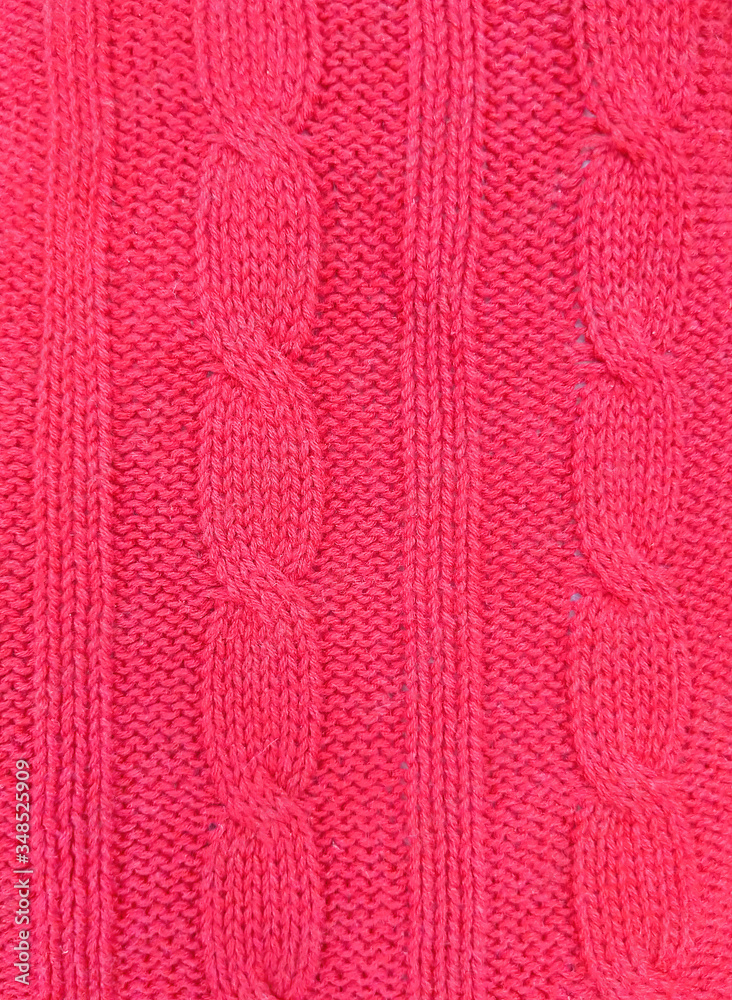Pink knitted texture background. Pattern of wool knitting for wallpaper and an abstract background.