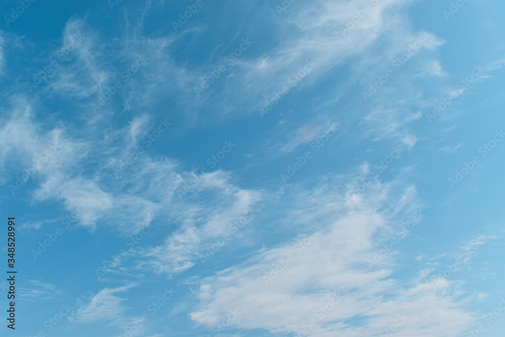 Fototapeta premium Clouds in the bright sky background in summer
