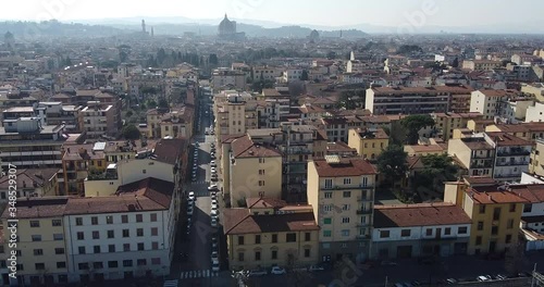 Aerial shot of Florence Campo Marte train station surrounded by special tools and equipments for train vehicles maintenance. Florence dome on background. Sunny day, winter season. Italy Europe photo