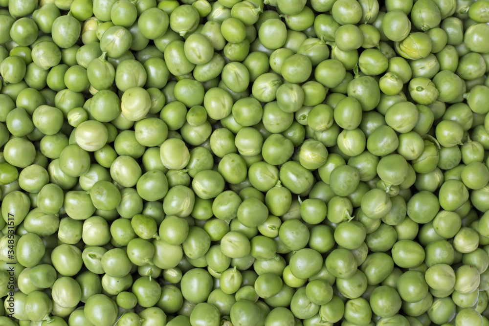 Fresh green peas background texture