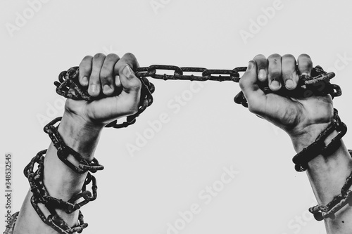 human hands in iron chains	
