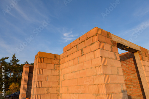 Interior of a Unfinished Red Brick House Walls under Construction without Roofing