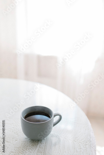 Fototapeta Naklejka Na Ścianę i Meble -  A cup of coffee on the table