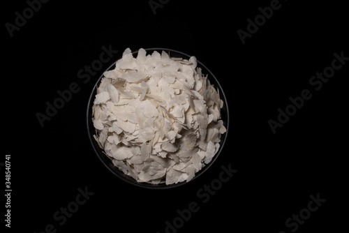 Top down image of a bowl of rice cereals in a dark copy space background. Food and product photography.