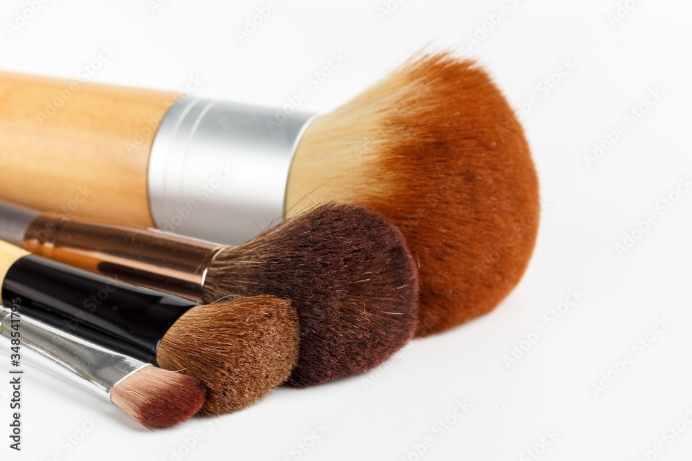 Makeup brushes of different sizes on a white background Makeup brushes of different sizes on a white background
