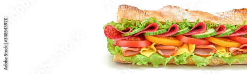 Submarine sandwich with ham, cheese, salami, tomato, lettuce salad, cucumber isolated on white. Homemade baguette sandwich with vegetables. Large sub sandwich closeup, banner