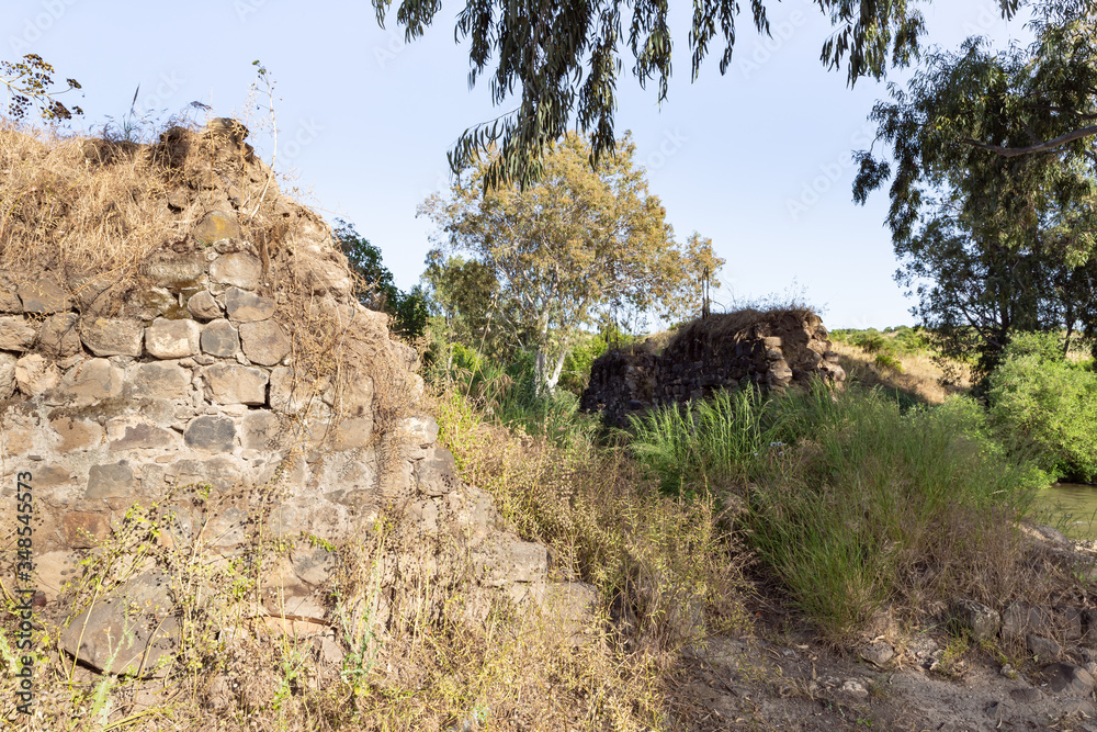 The ruins of the fortress wall of the Ateret fortress - Metzad Ateret - Qasr Atara - located next to the ford of the Jacob daughters on the Jordan River, in northern Israel The ruins of the fortress wall of the Ateret fortress - Metzad Ateret - Qasr Atara - located next to the ford of the Jacob daughters on the Jordan River, in northern Israel