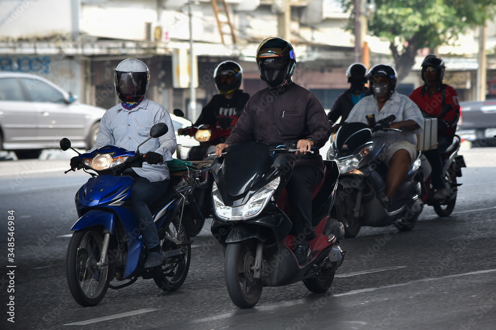 Unidentified motorcycle riders in Bangkok, Thailand. Motorcycles are commonly used as transport throughout Thailand. Unidentified motorcycle riders in Bangkok, Thailand. Motorcycles are commonly used as transport throughout Thailand.