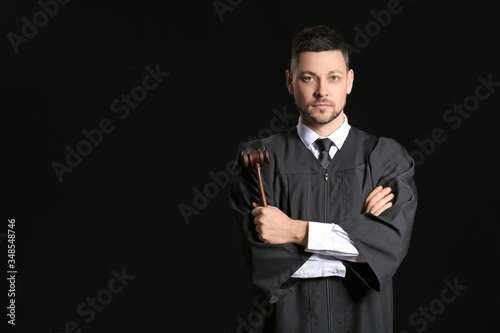 Tablou canvas Male judge on dark background