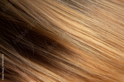 The texture of highlighted hair. Dark hair roots