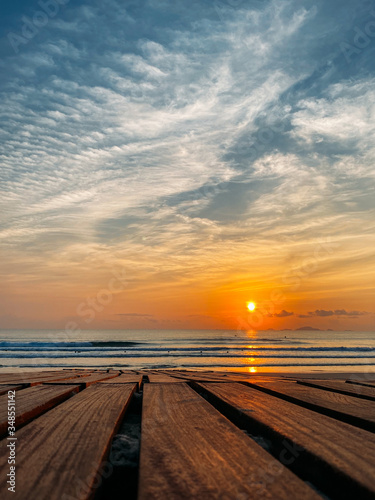 Dawn on the sea with a view of the horizon  colorful sky from sun rays  clouds on a sky  Vertical frame