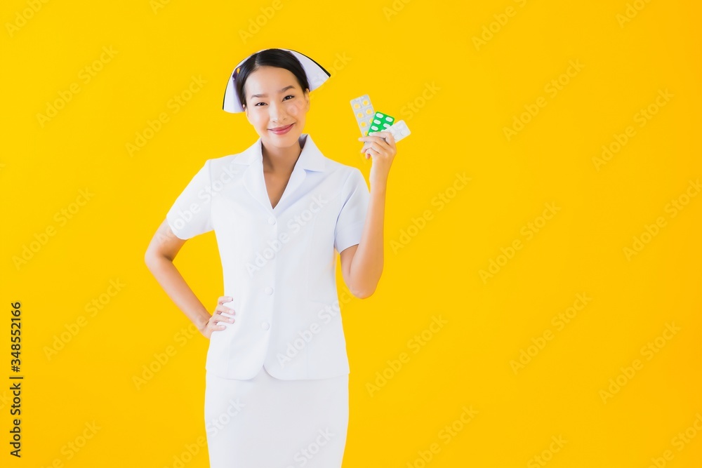 Portrait beautiful young asian woman thai nurse with pill or drug Portrait beautiful young asian woman thai nurse with pill or drug