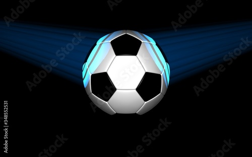soccer ball lit by light on black background