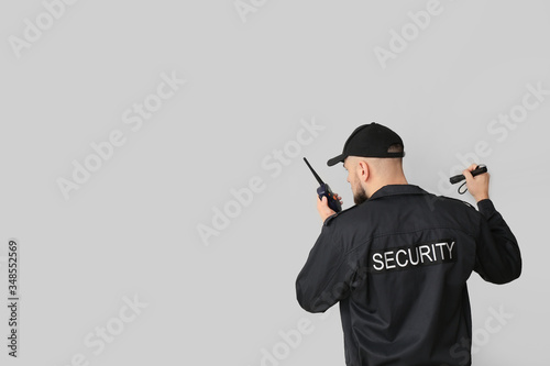 Male security guard with fl...