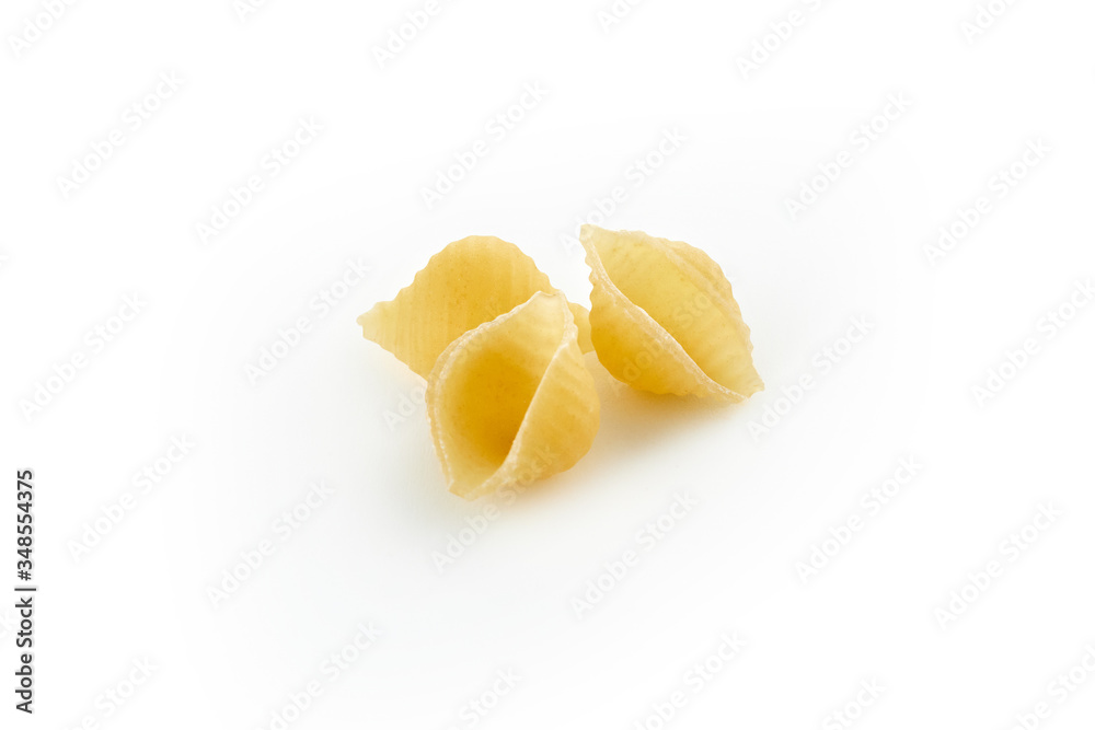 Italian raw dry pasta conchiglie rigate isolated on white background Italian raw dry pasta conchiglie rigate isolated on white background