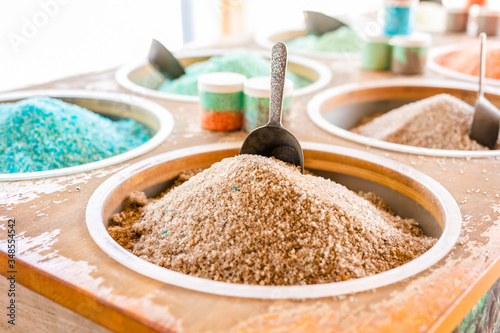 Dead Sea colorful salt and scoop on a buckets at a souvenir shop in Kalia Beach, West Bank.