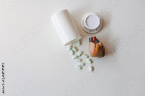 Heart medication that was prepared on the table in the room in the morning The concept of health care and treatment of heart disease with medication as recommended by doctors. photo