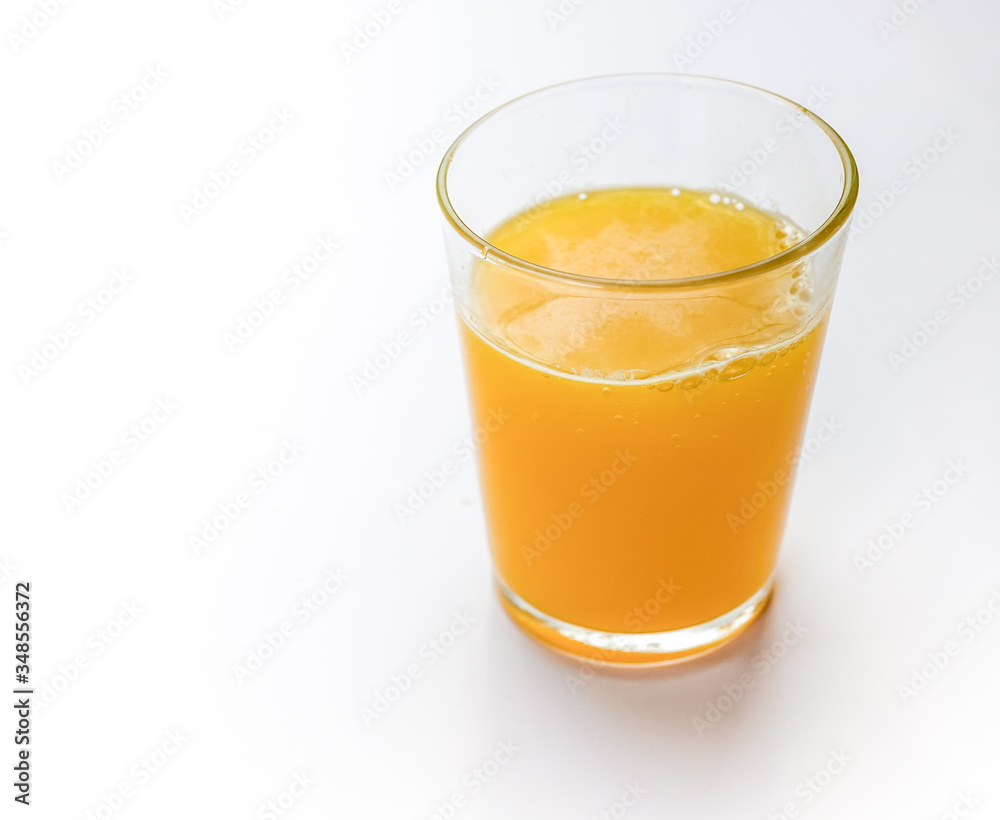 Orange juice in glass isolated on white background Orange juice in glass isolated on white background