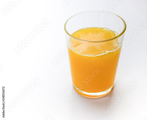 Orange juice in glass isolated on white background