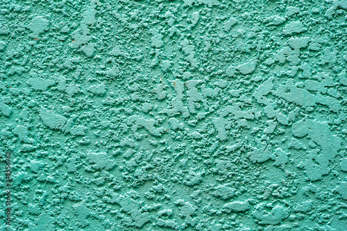 Vintage Pastel green mint color painted on old cement wall house in retro texture concept.