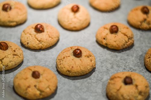 Hazelnut cookies on baking sheet close up