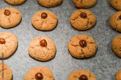 Hazelnut cookies on baking sheet close up