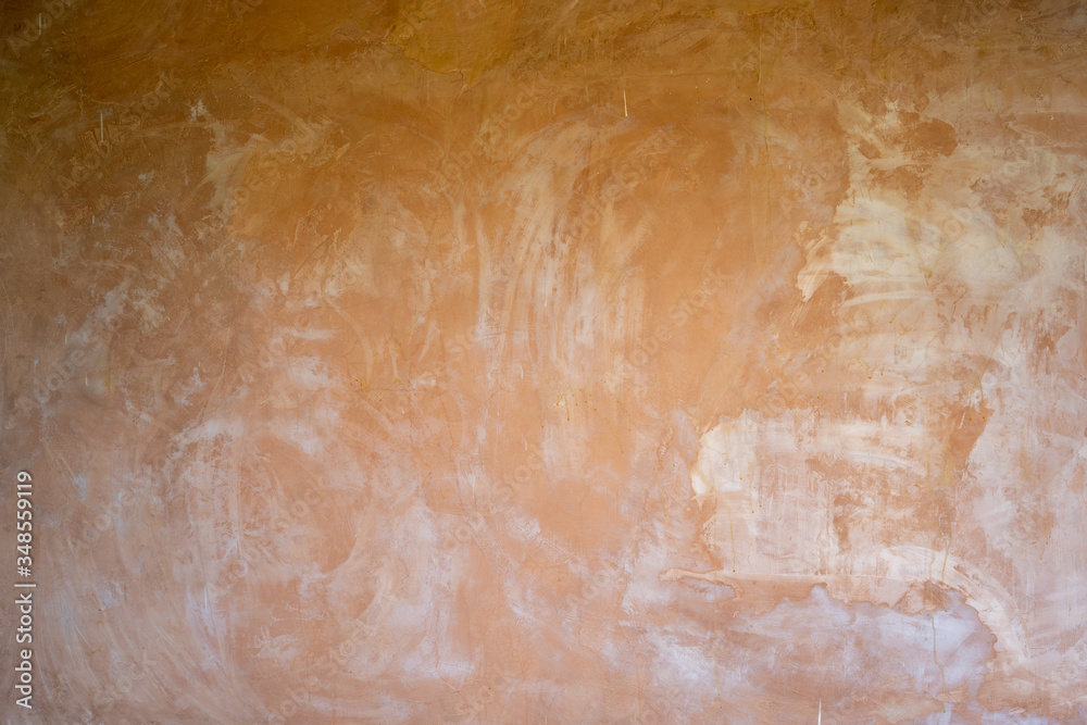Polished orange plaster wall for background. 