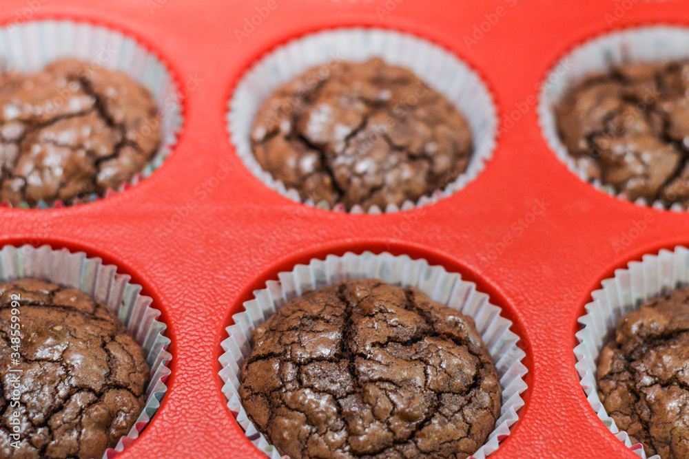 Fototapeta premium freshly baked chocolate muffins closeup
