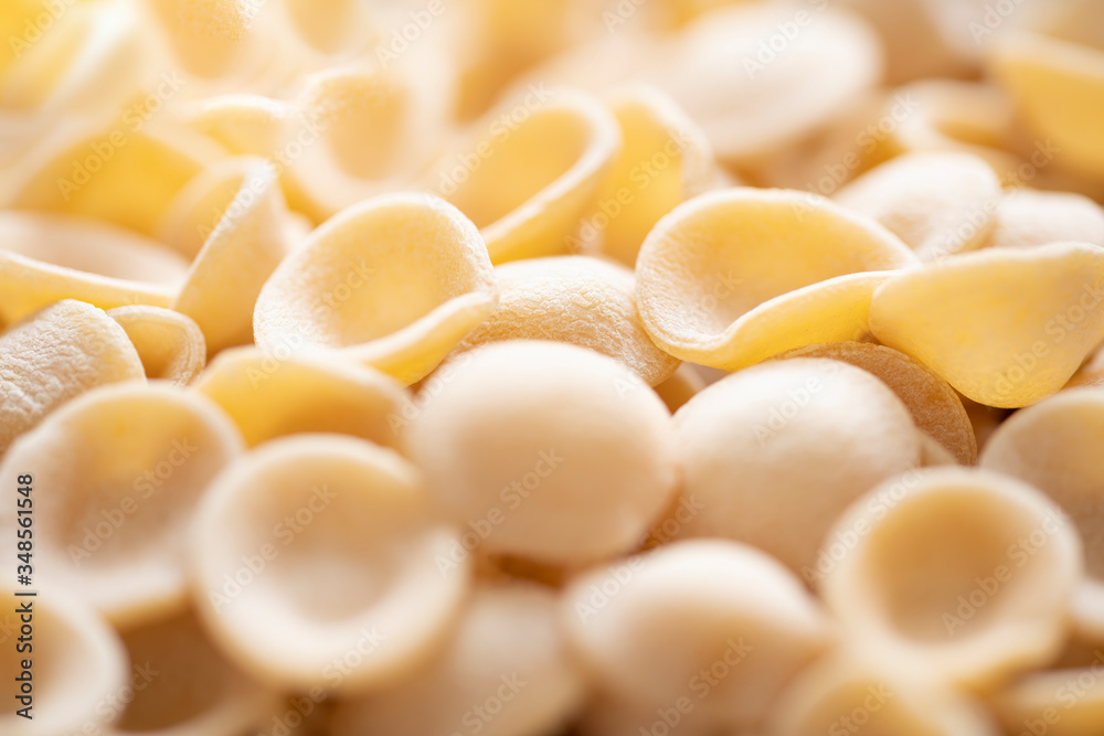 dried italian orecchiette pasta blur defocused dried italian orecchiette pasta blur defocused