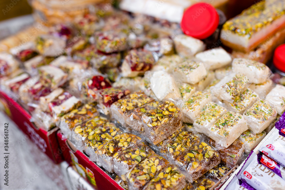 Fototapeta premium Spices, nuts and other food for sale at a market in the old city Jerusalem, Israel