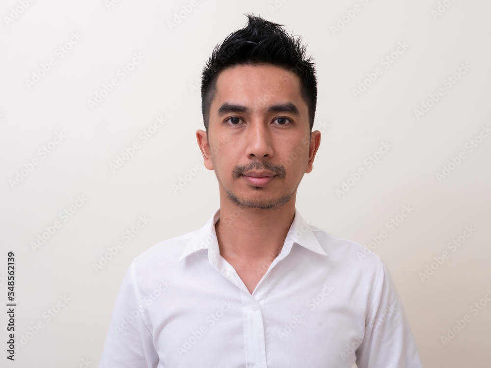 Portrait of smiling young man wearing white shirt Portrait of smiling young man wearing white shirt