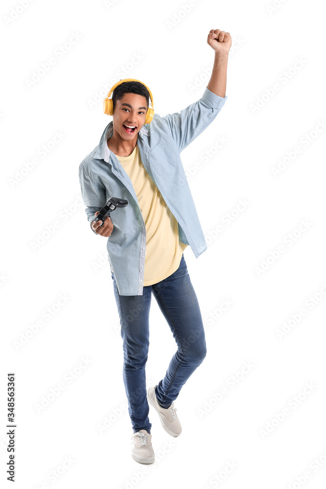 African-American teenage boy playing video game on white background African-American teenage boy playing video game on white background