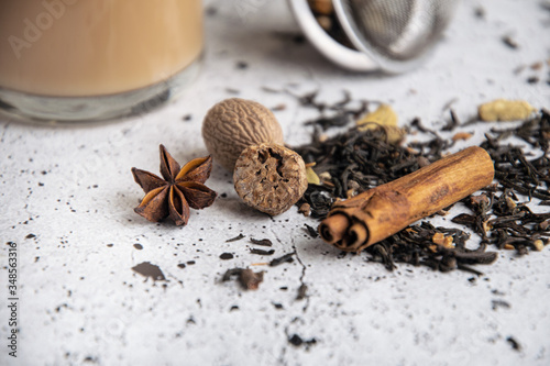 Fototapeta Naklejka Na Ścianę i Meble -  Masala chai black spiced tea with spices, cinnamon, nutmeg, cardamom, star anise, clove