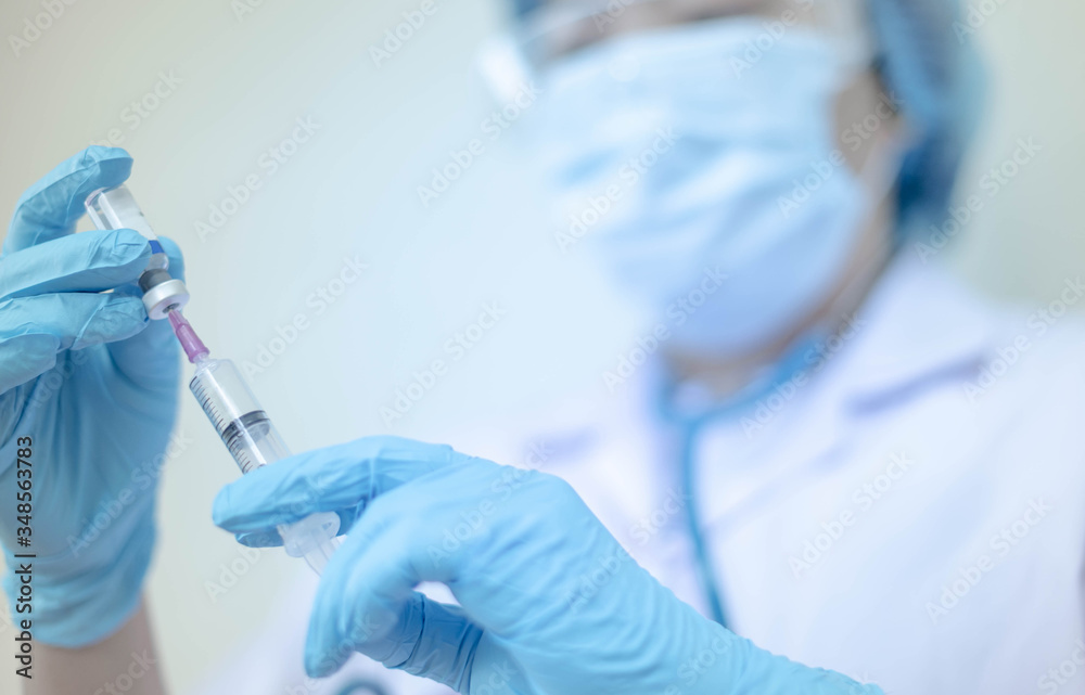 Syringe medical injection in hand holding with medicine dose vaccination equipment with needle. vaccination to patient for coronavirus (COVID-19) protection. Syringe medical injection in hand holding with medicine dose vaccination equipment with needle. vaccination to patient for coronavirus (COVID-19) protection.